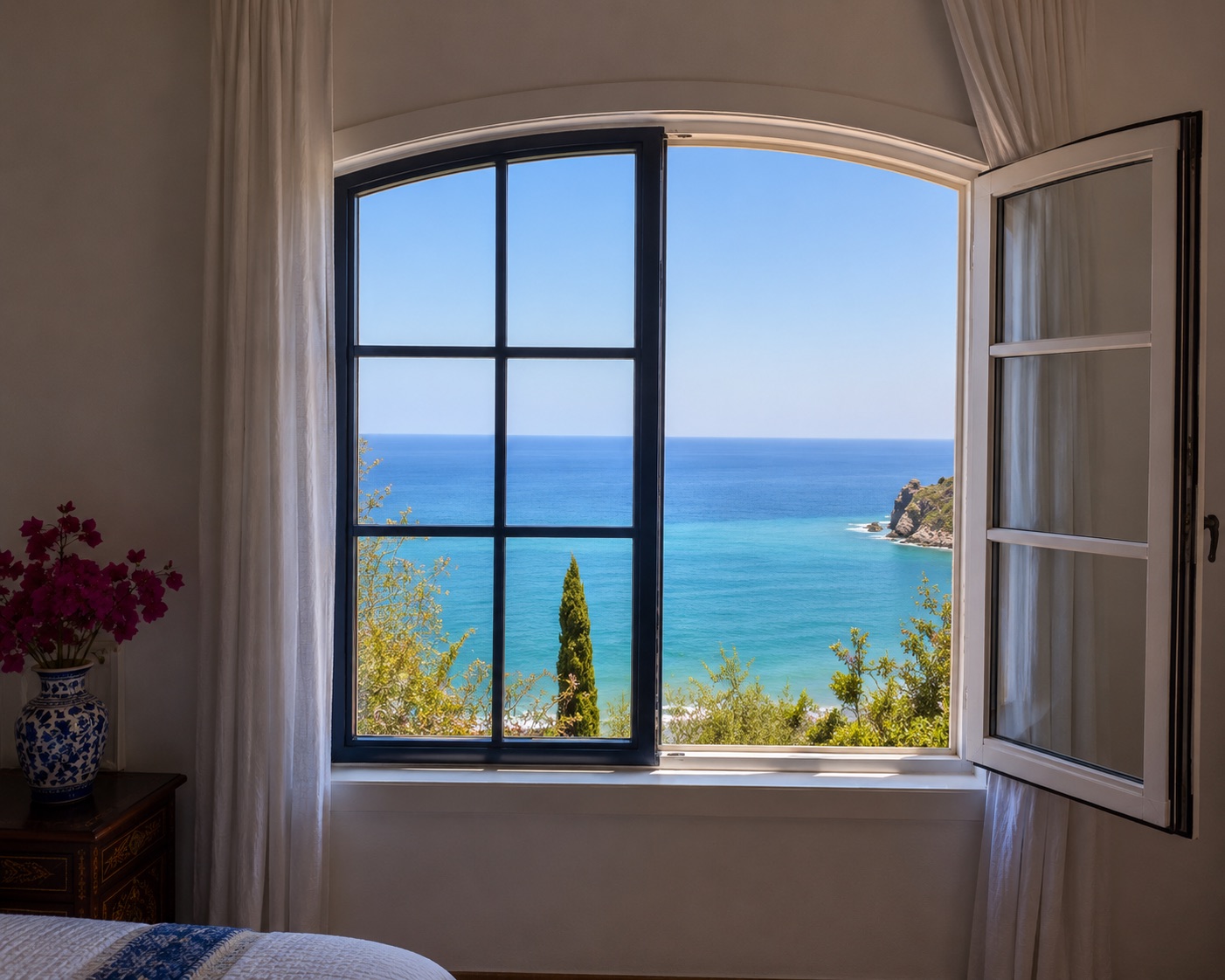A room window opening onto the turquoise sea